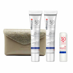 Coffret Ultrasun comprenant 2 crèmes SPF50+ anti-âge et anti-pigmentation pour le visage, ainsi qu'une protection labiale SPF30.